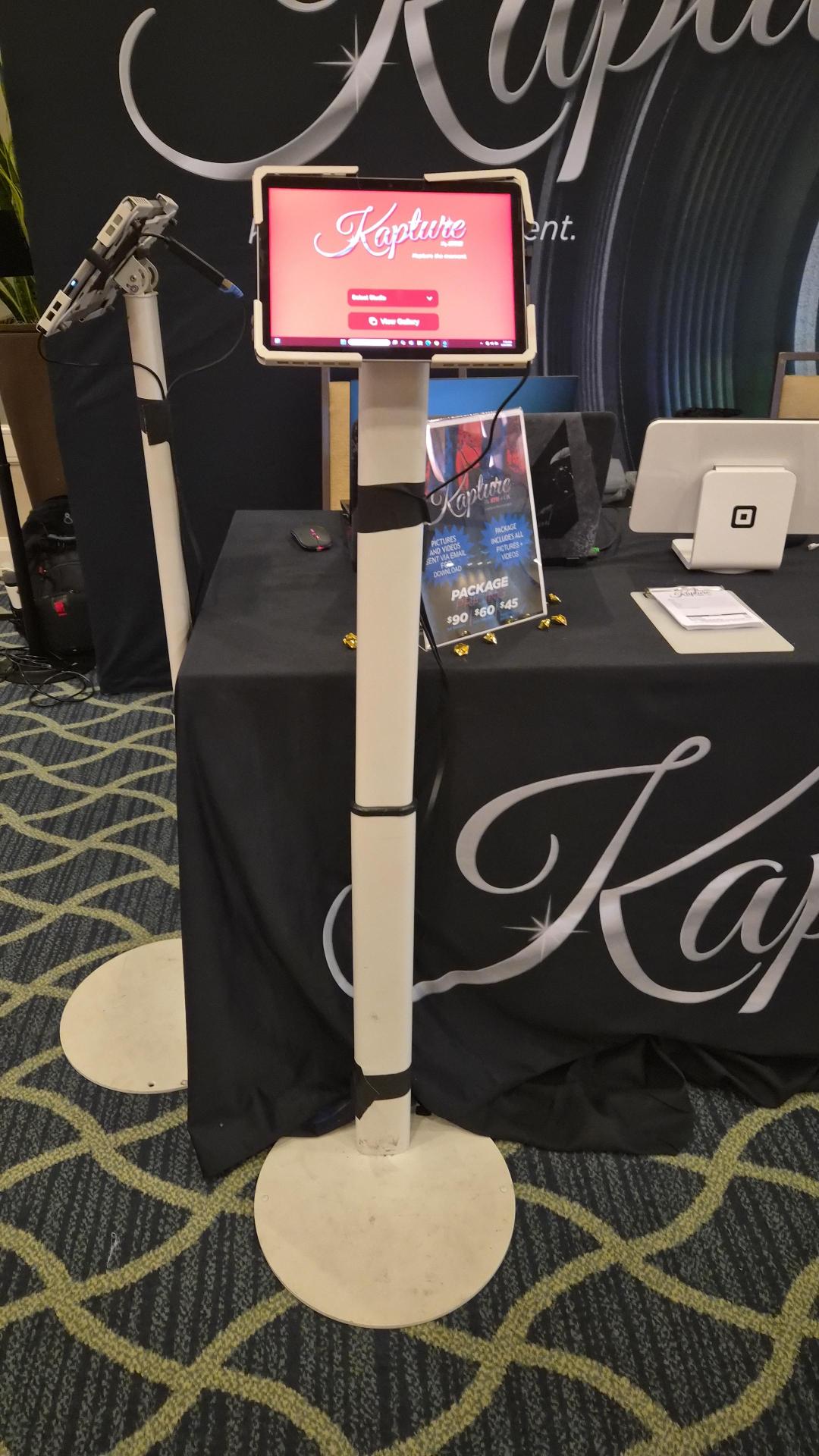 Kapture booth table with pricing and tablet stand